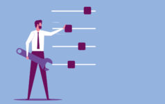 An executive holding a spanner adjusts the dials of specialisation