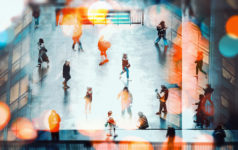 Crowds of people walking through a public space