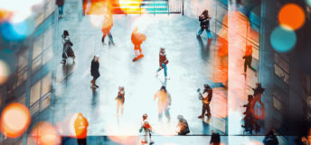 Crowds of people walking through a public space