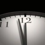clock with hands nearing 12