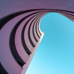 Low angle view of modern building against clear blue sky, Berlin Kreuzberg
