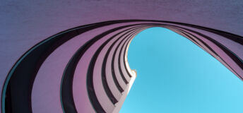 Low angle view of modern building against clear blue sky, Berlin Kreuzberg