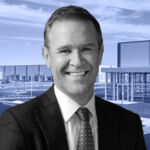 Peter Gordon of AllianceBernstein in front of Hampton Business District in Westhampton Beach, New York