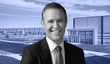 Peter Gordon of AllianceBernstein in front of Hampton Business District in Westhampton Beach, New York