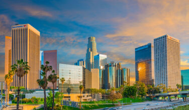 Kennedy Wilson to be taken private in $1.65bn Fairfax-linked deal Dusk light with dramatic clouds in downtown Los Angeles and freeway,California