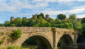X-Caliber sharpens multifamily bridge lending program Dinham bridge over the River Teme with Ludlow castle behind in the town of Ludlow, Shropshire UK in Landscape orientation