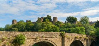 Dinham bridge over the River Teme with Ludlow castle behind in the town of Ludlow, Shropshire UK in Landscape orientation