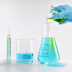 CalSTRS’ current real estate refocus is demonstrably including more credit Chemist formulating solution substances, Scientist with equipment and science experiments, Laboratory glassware containing chemical liquid.