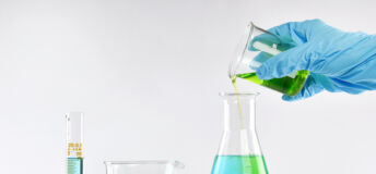 Chemist formulating solution substances, Scientist with equipment and science experiments, Laboratory glassware containing chemical liquid.