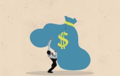 Businessman burdened by a blue sack of money