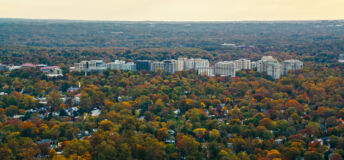 Helicopter shot of Chevy Chase, Maryland, the northwestern suburbs of Washington, DC, on a hazy afternoon in Fall.