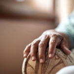 Elderly person sitting in armchair