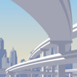 Photo of a highway overpass with a city skyline in the back.