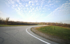Photo of an empty road in the countryside.