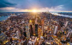 Aerial photo of New York City at sunset.