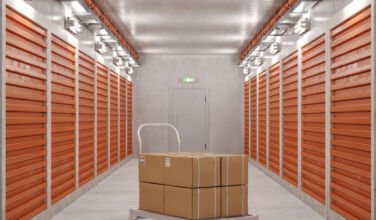 Self-storage gains momentum as key private credit lending sector Self Storage Units And Close-up Of Hand Truck With Cardboard Boxes In Corridor