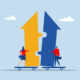 Illustration of two arrows pointing upward fitting into each other like puzzle pieces.