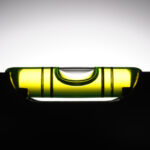 Silhouette of level against white background with copy space.