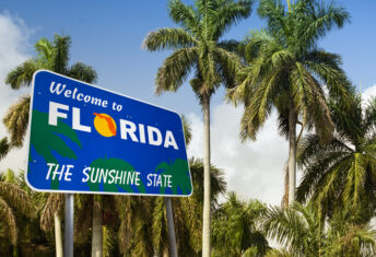 Palm Beach Gardens marks Florida’s next condo financing frontier Welcome to Florida billboard sign
