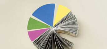 Manulife Investment Management on how relative value opportunities can reward disciplined lenders US dollar Pie Chart representing Smart portfolio allocation between cash and assets, diversified financial strategy. table top view