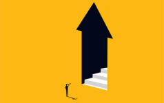 Businessman looks at stairs in the door arrow pointing up